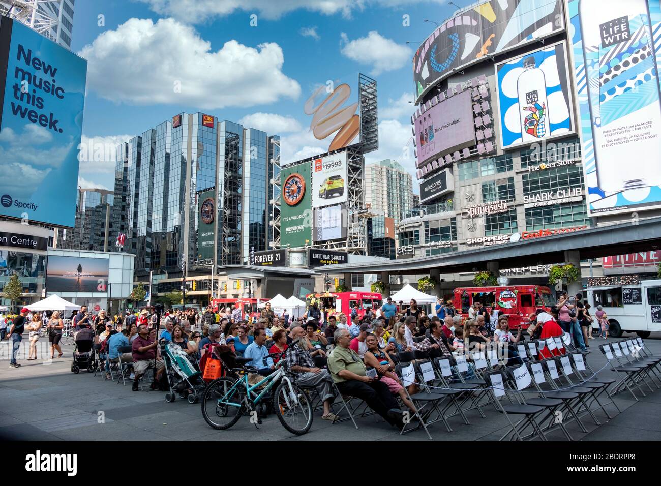 Crowds of people watching entertainment at Yonge and Dundas square in