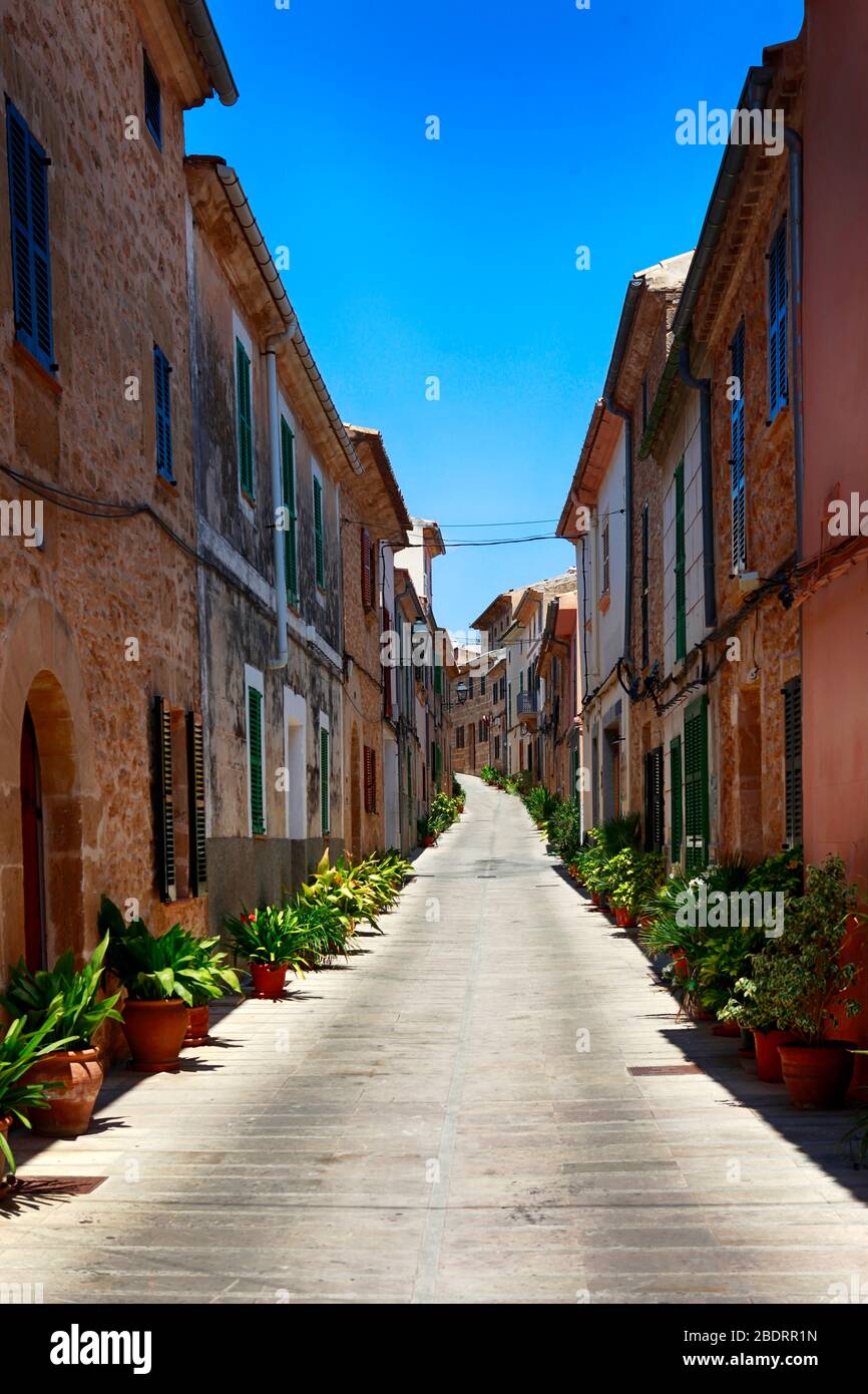 The narrow street in the old town of Alcudia, Mallorca Stock Photo