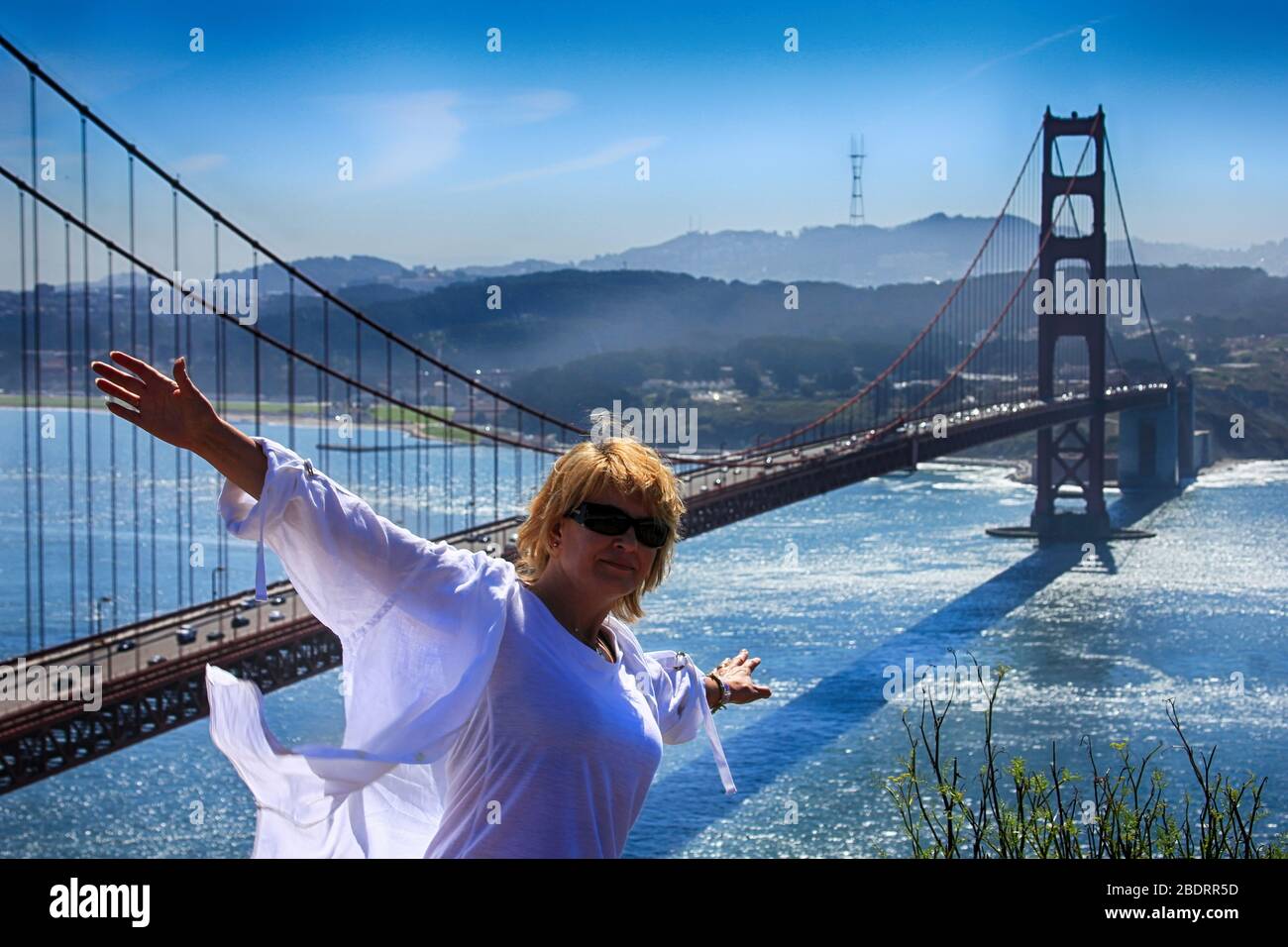 Girl tourist on the background of the Golden Gate Bridge in San Francisco. Stock Photo