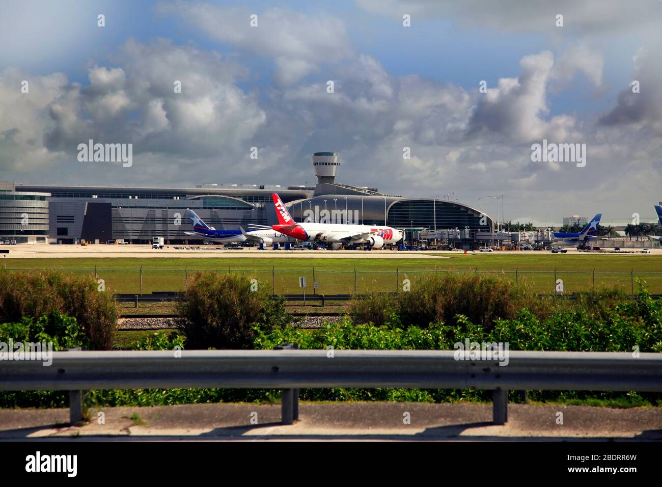 Miami, Florida, USA - May 9, 2013: Panoramic photo of the famous Miami International Airport with lots of airplanes loading and unloading passenger an Stock Photo