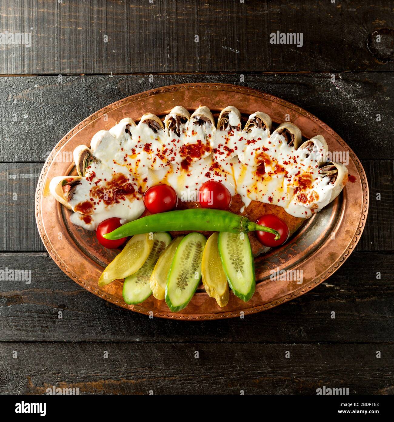 flatbread kebab doner slices served with yogurt tomato sauce fresh and