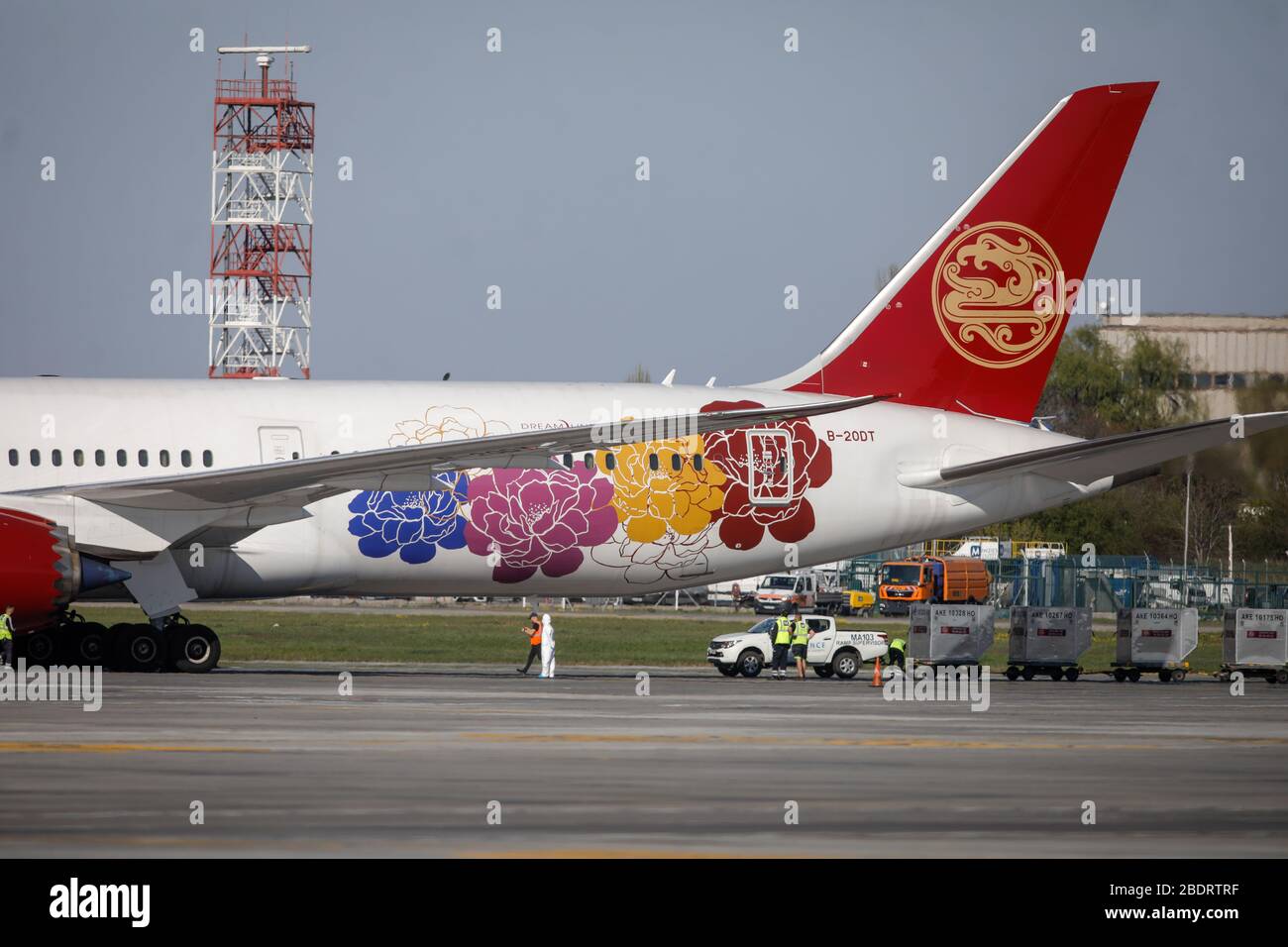 Otopeni, Romania - April 9, 2020: Boeing 787 airplane of the Juneyao Airlines on the Henri Coanda International Airport. Stock Photo