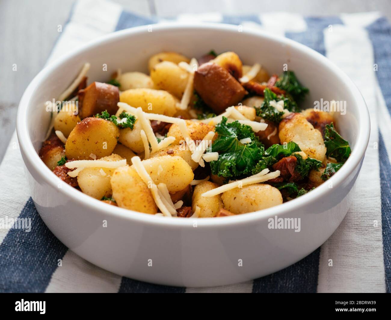Gnocchi With Vegan Sausage Kale And Sun Dried Tomatoes Stock Photo Alamy
