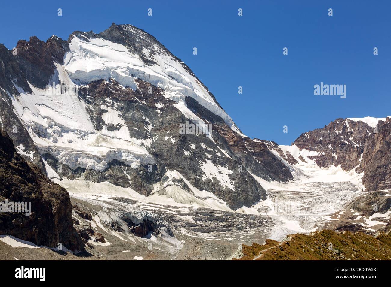 Dent d'Hérens mountain peak, north side with glaciers. Mountain wall, seracs. Swiss Alps. Europe. Stock Photo