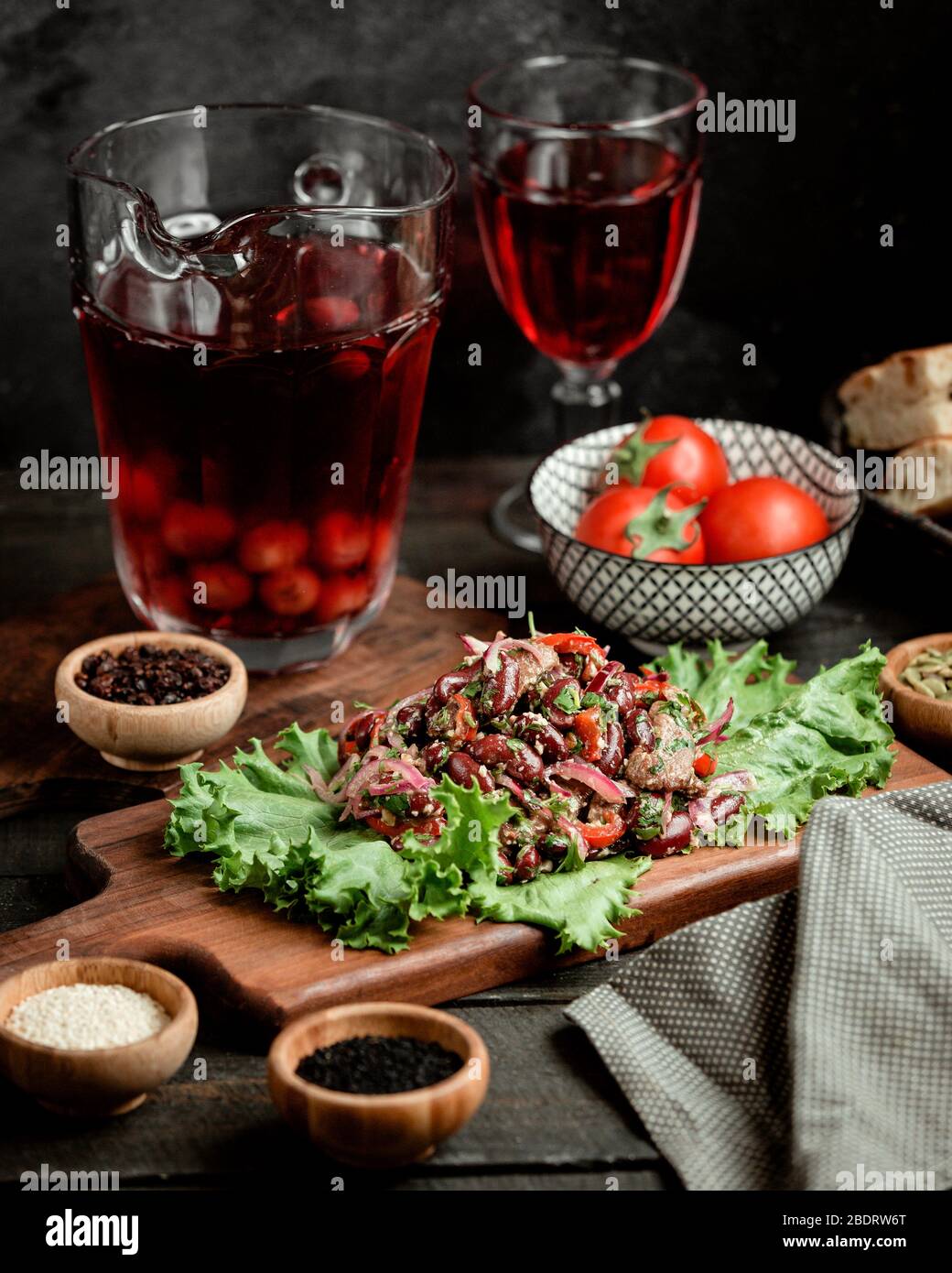 lamb kebab salad with red onion tomato walnut parsley and black beans