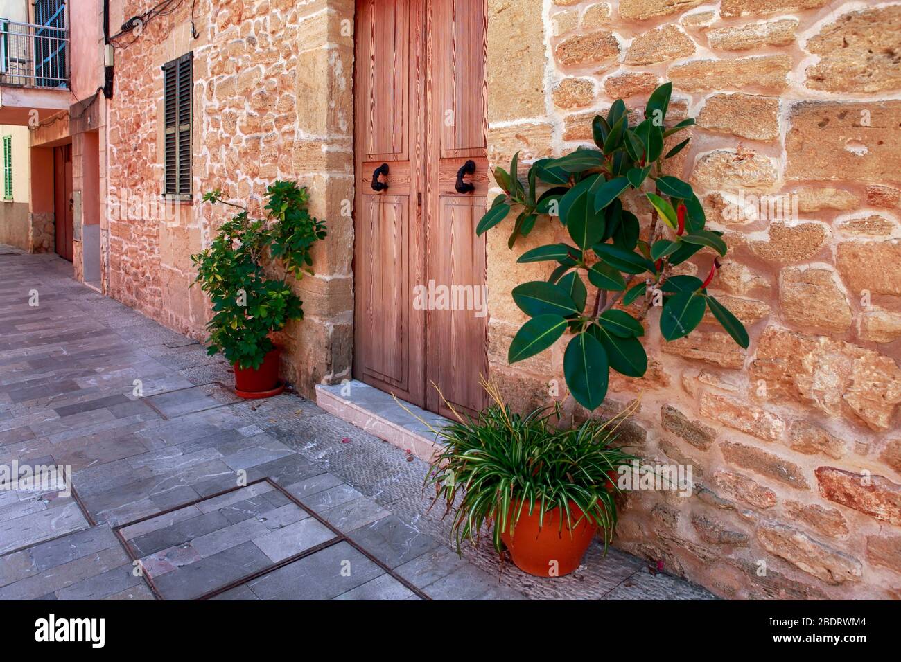 The narrow street in the old town of Alcudia, Mallorca Stock Photo