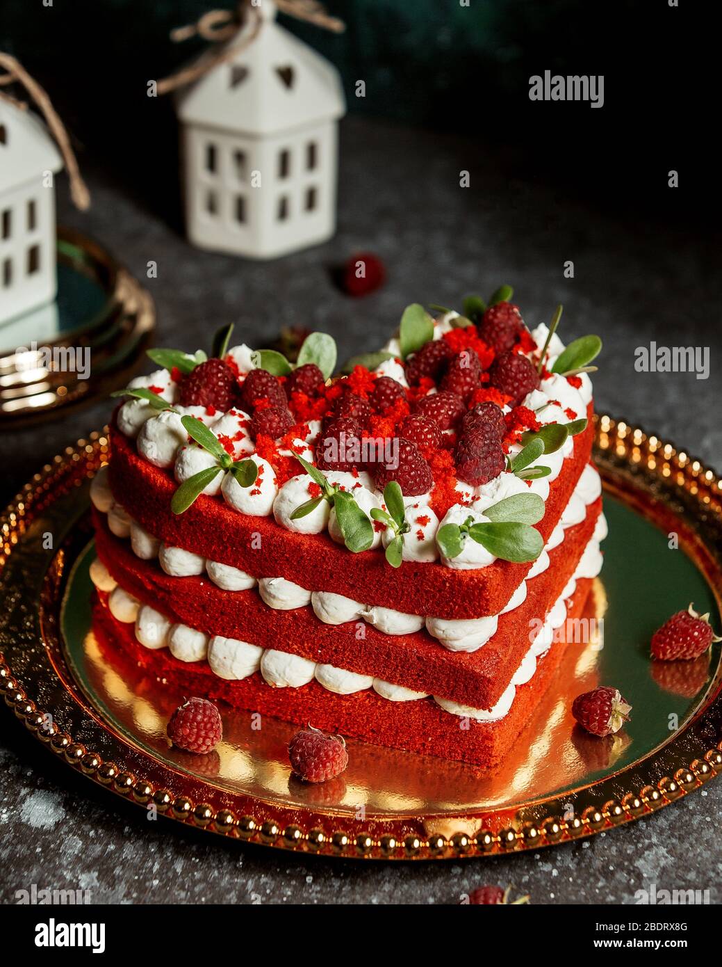 red velvet cake in heart-shape garnished with raspberries and mint leaves  Stock Photo - Alamy