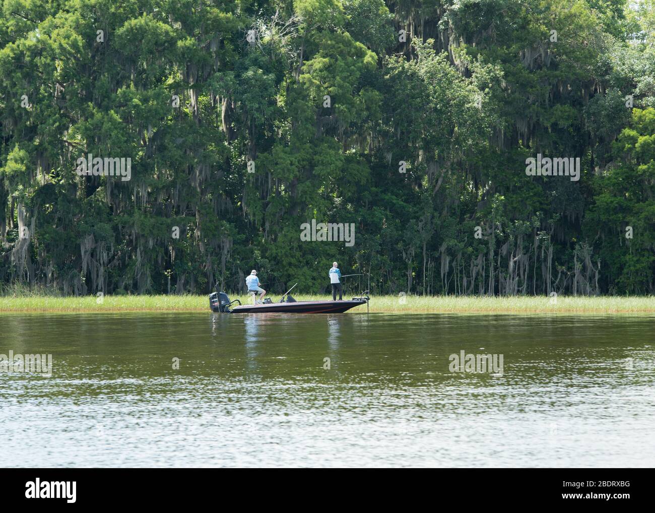 Two men fishing from a boat hi-res stock photography and images - Alamy