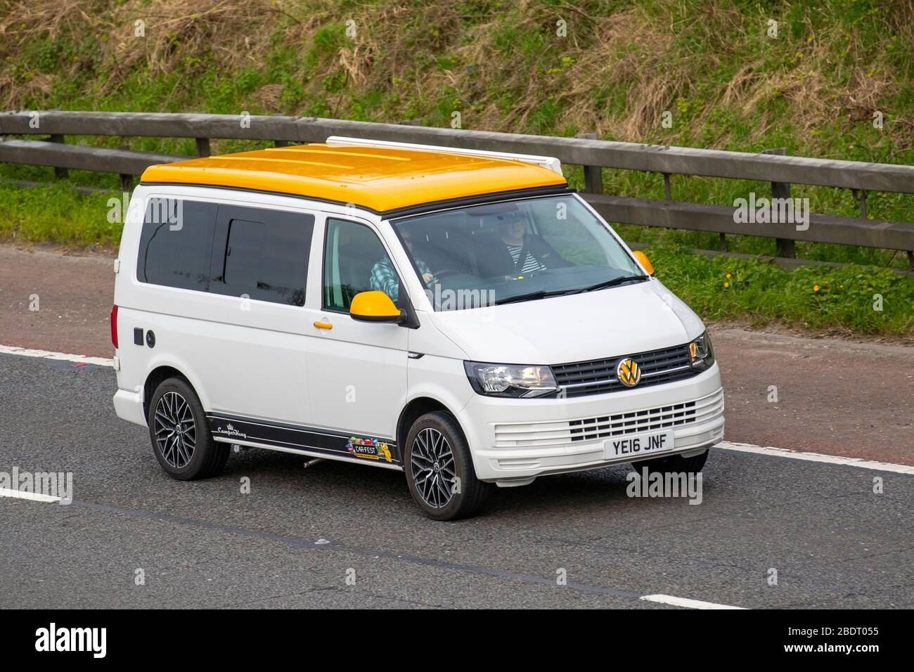 2016 white yellow Volkswagen Transporter T28 S-Line TD; Touring Caravans and Motorhomes, campervans, RV leisure vehicle, family holidays, caravanette vacations, caravan holiday, life on the road, Stock Photo
