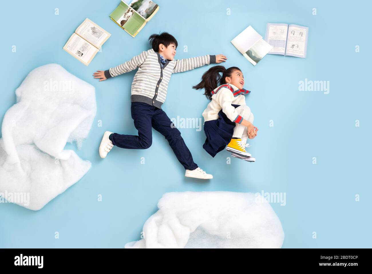 Happy children playing in the sky Stock Photo - Alamy