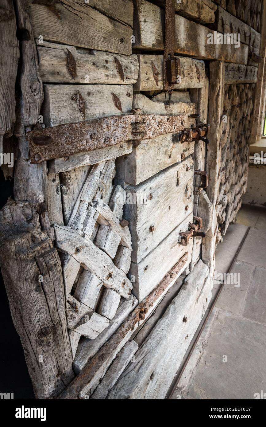 Chepstow castle has on display the oldest surviving castle doors in Europe. Made from green oak in around 1190AD Stock Photo