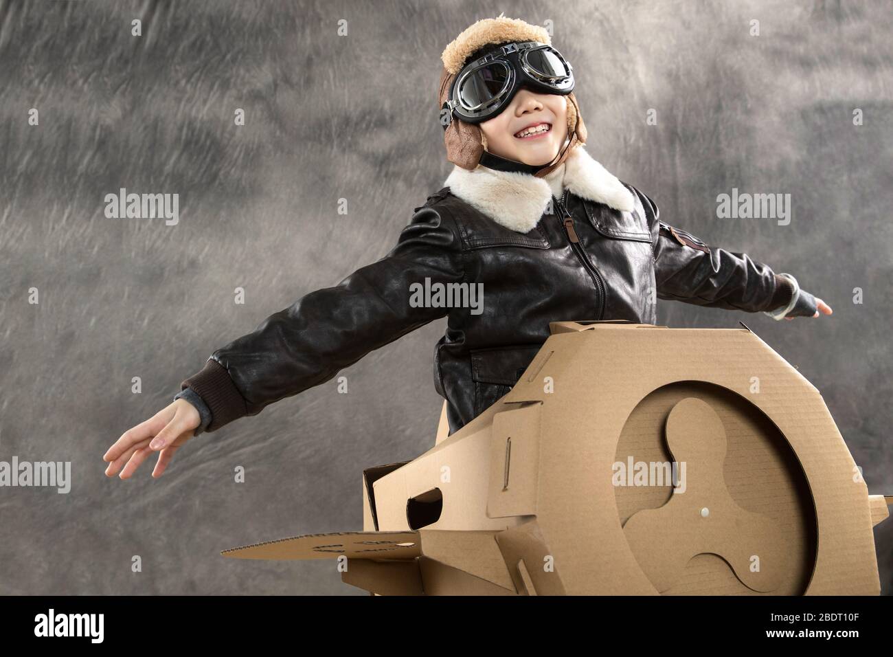 Happy children's driving paper airplanes Stock Photo - Alamy