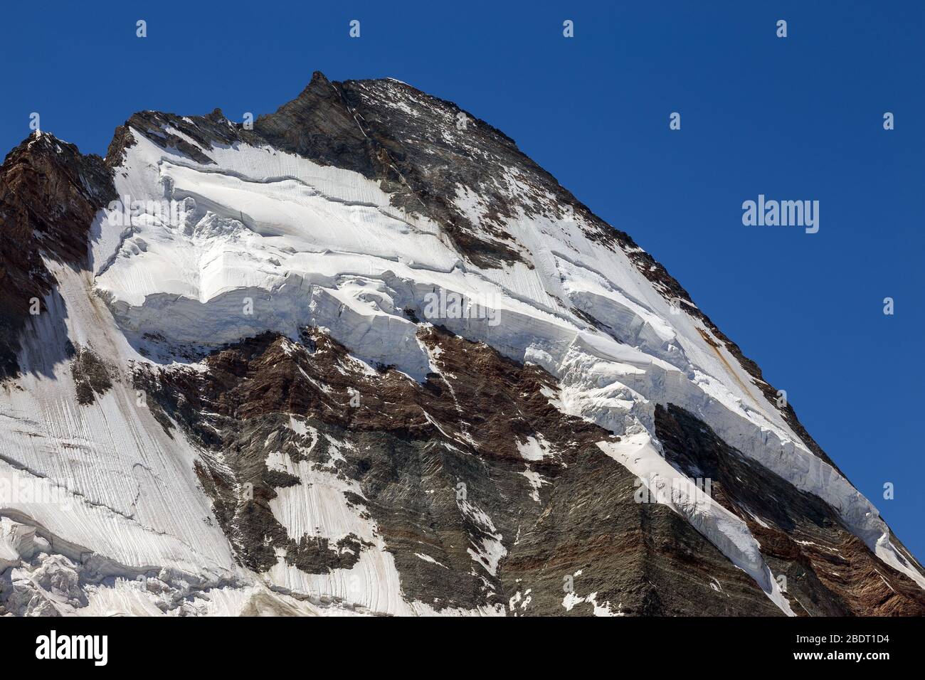 Dent d'Hérens mountain peak, north side with glaciers. Mountain wall, seracs. Swiss Alps. Europe. Stock Photo