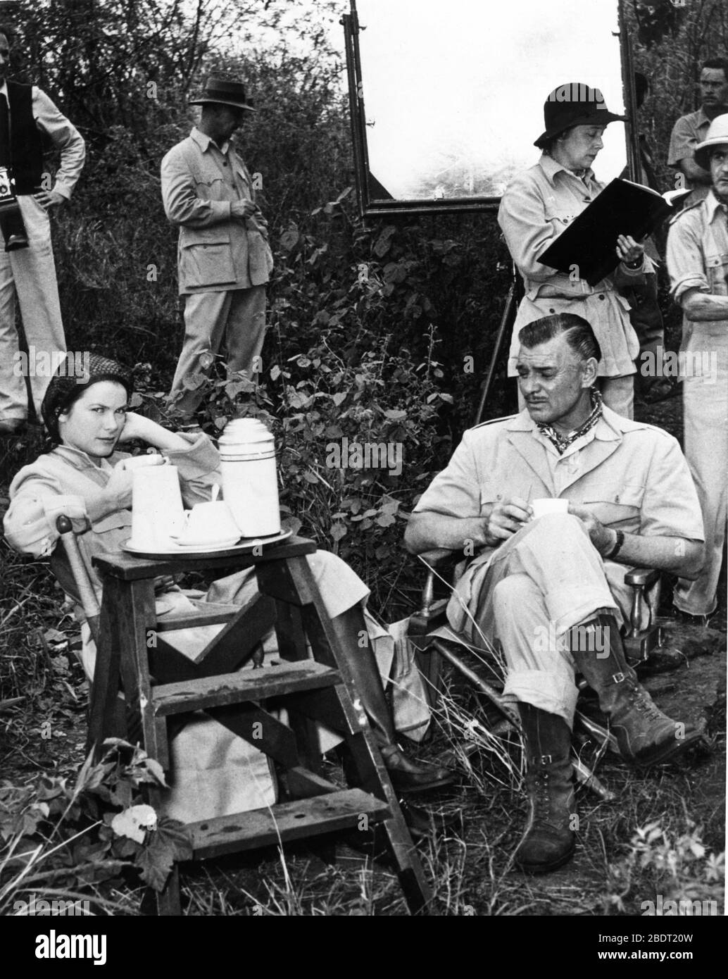 CLARK GABLE and GRACE KELLY on set location candid during filming in Africa for MOGAMBO 1953 director JOHN FORD screenplay John Lee Mahin play Wilson Collison Metro Goldwyn Mayer Stock Photo