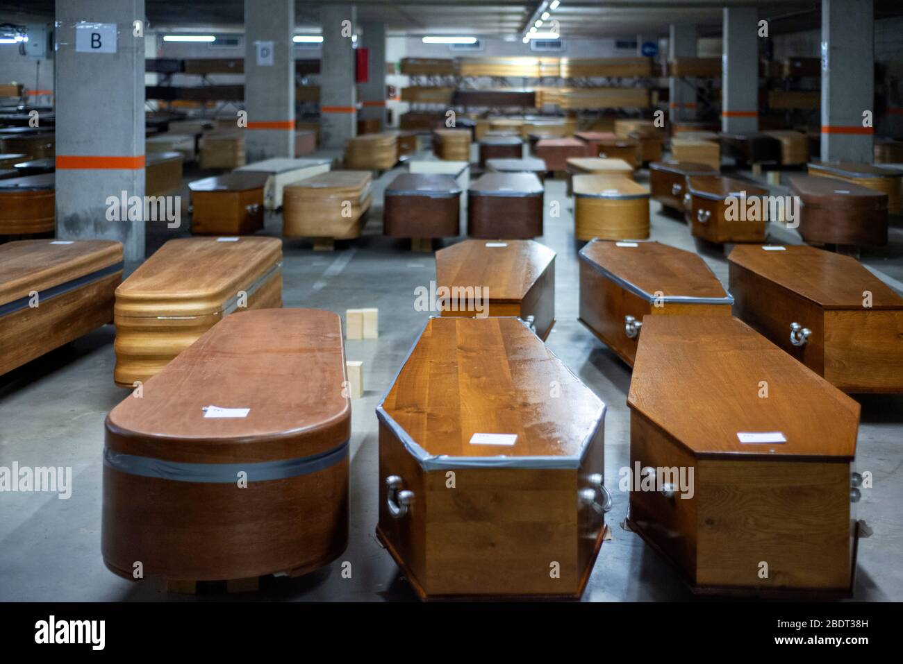 Parking area of Collserola Mortuary full of coffins, of which most have corpse and others waiting for those to die in the next days. Spain is one of t Stock Photo