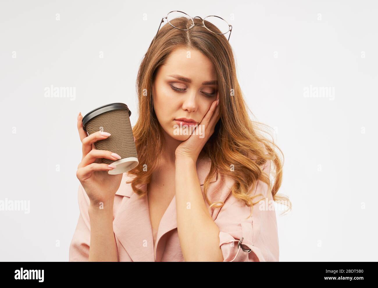 female office worker holds Cup of coffee head  Stock Photo