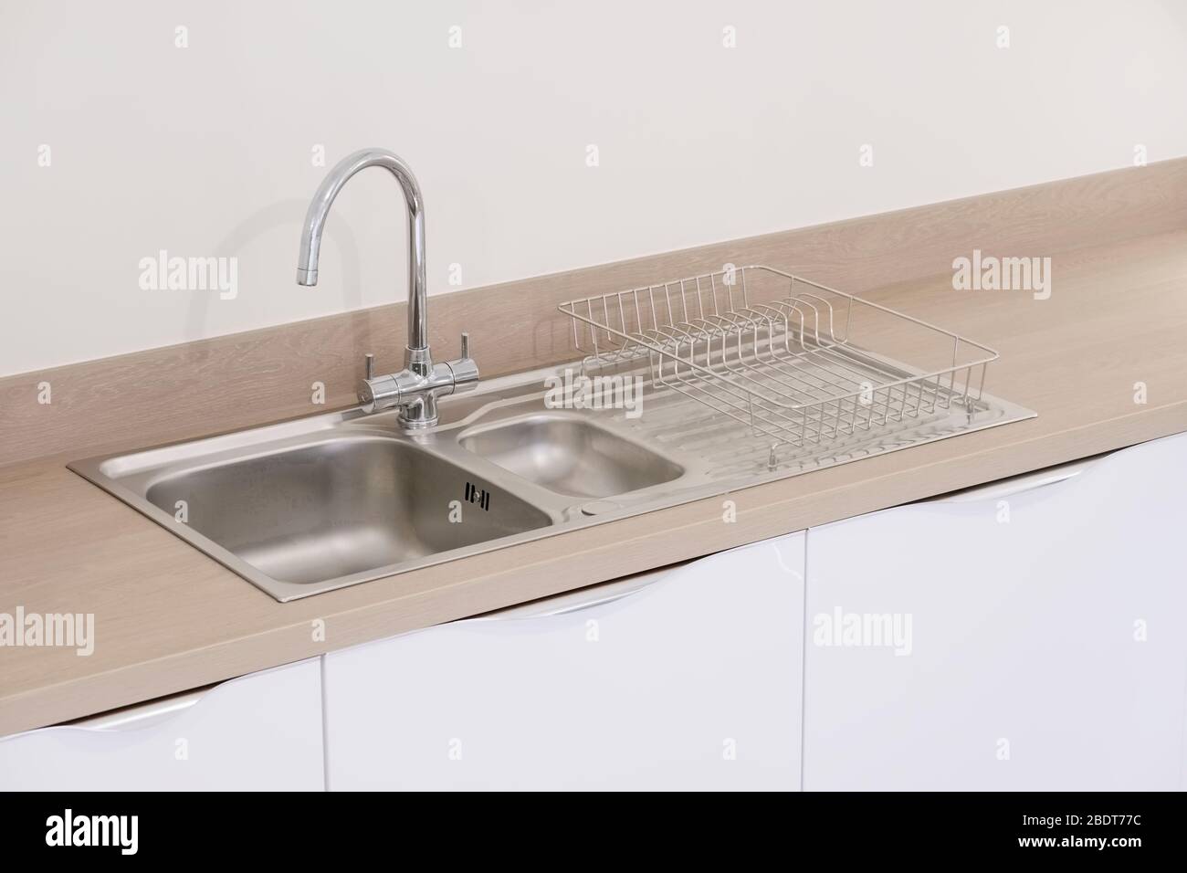 New kitchen sink fitted in new build modern house Stock Photo Alamy