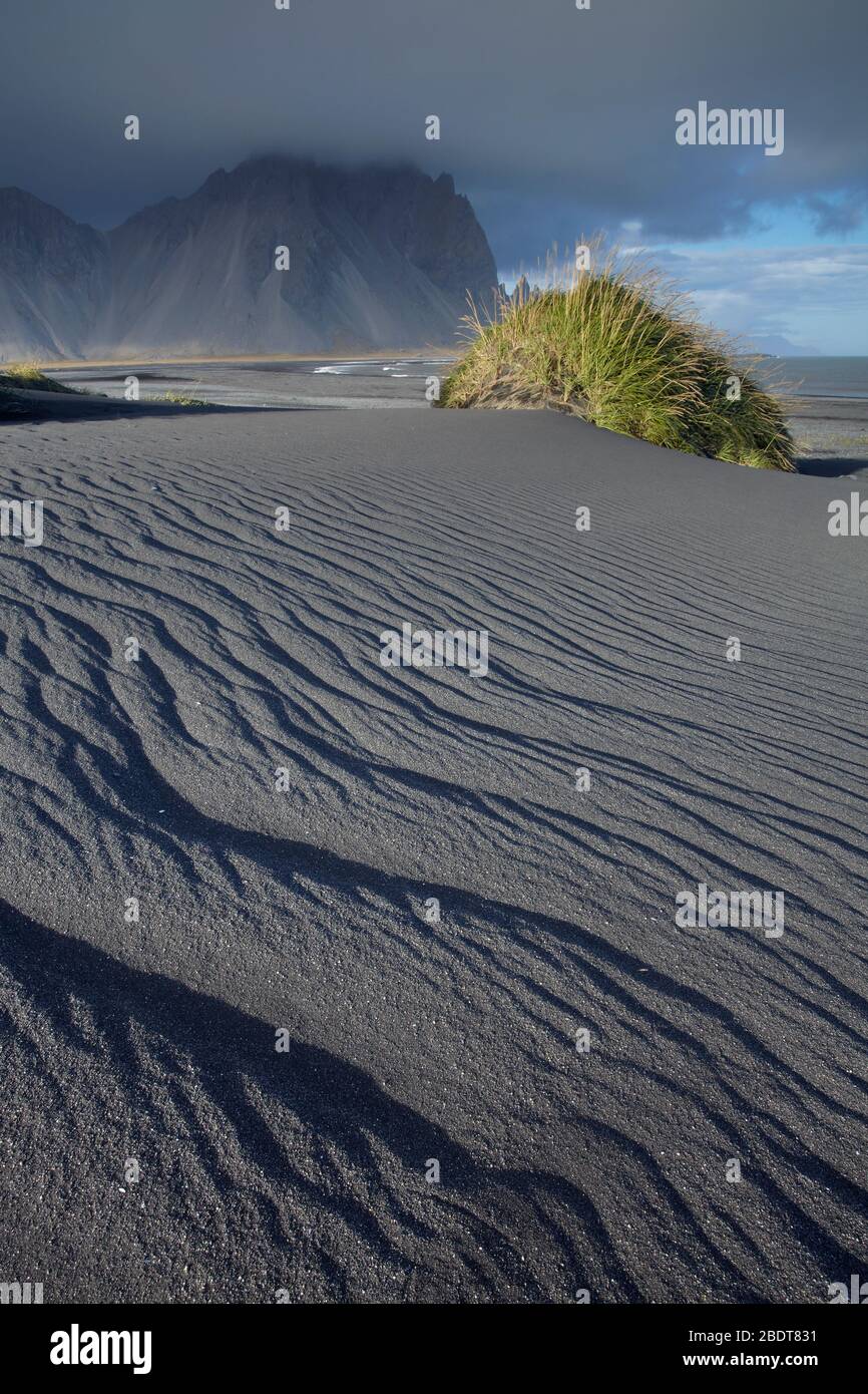 Black volcanic sand dunes at Vestrahorn on the Stokksness peninsula of East Iceland Stock Photo