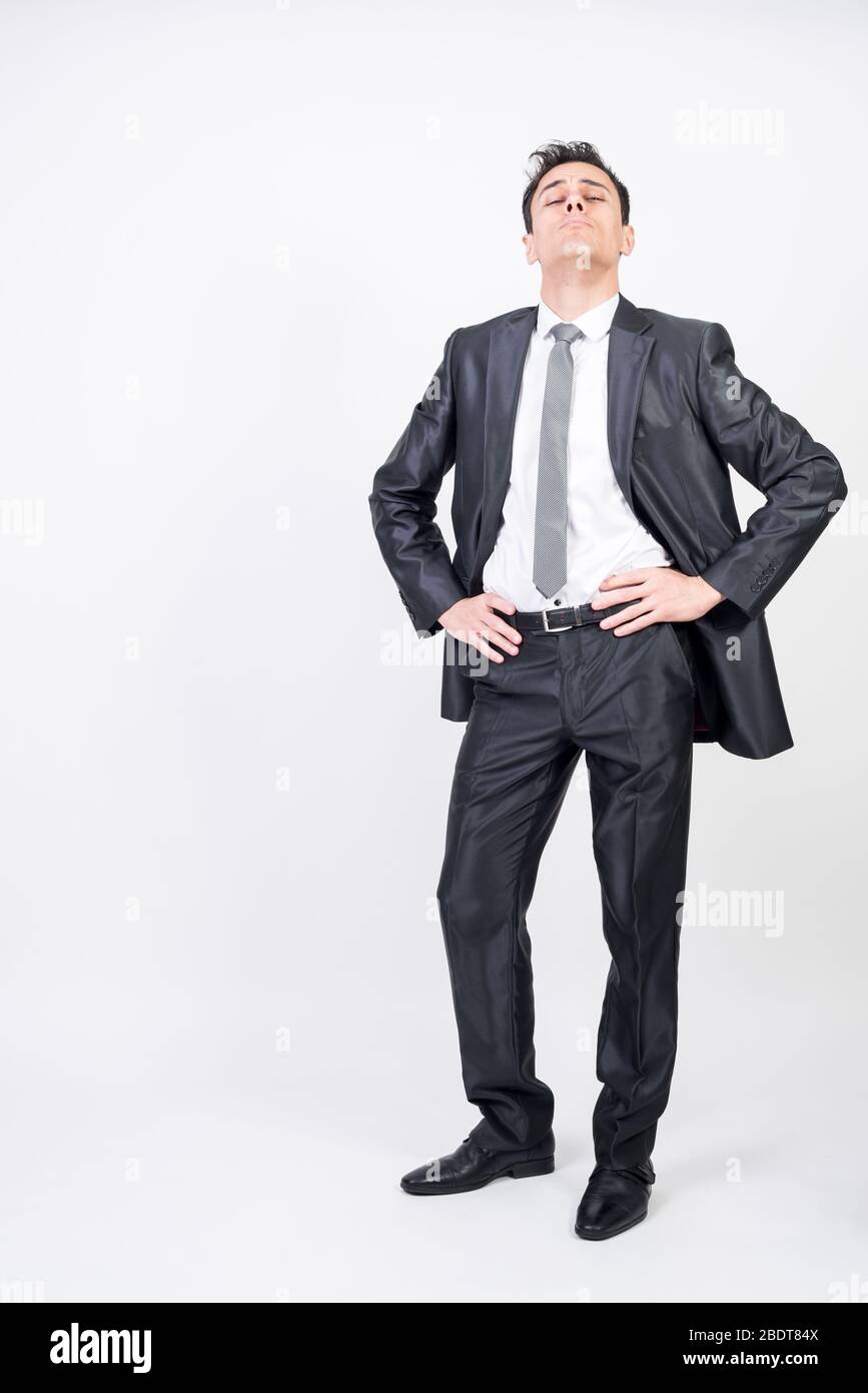 Arrogant man in suit. White background, full body Stock Photo Alamy
