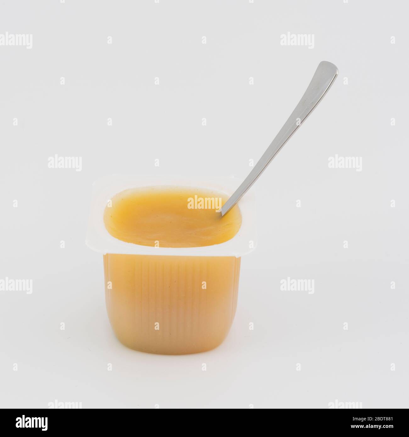 Applesauce portion on white background Stock Photo Alamy