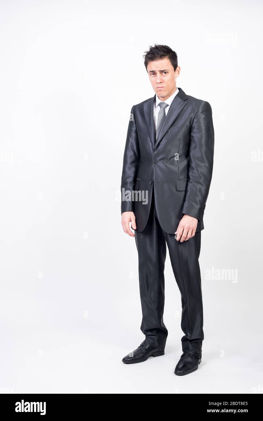 Sad man in suit. White background, full body Stock Photo