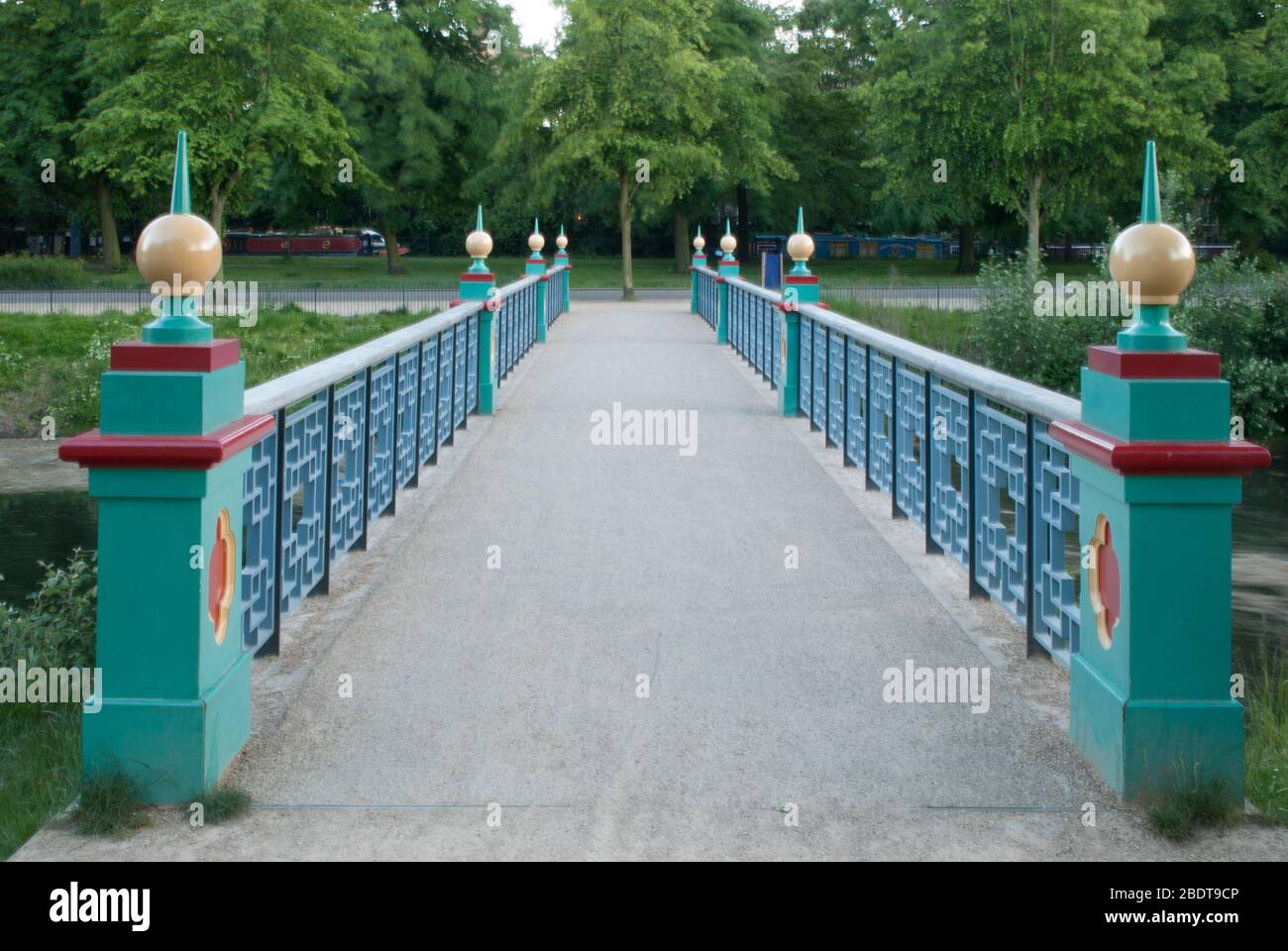 Green Red Gold Timber Structure Wooden Chinese Bridge in Victoria Park, Grove Road, London E3 5TB by Sir James Pennethorne Stock Photo