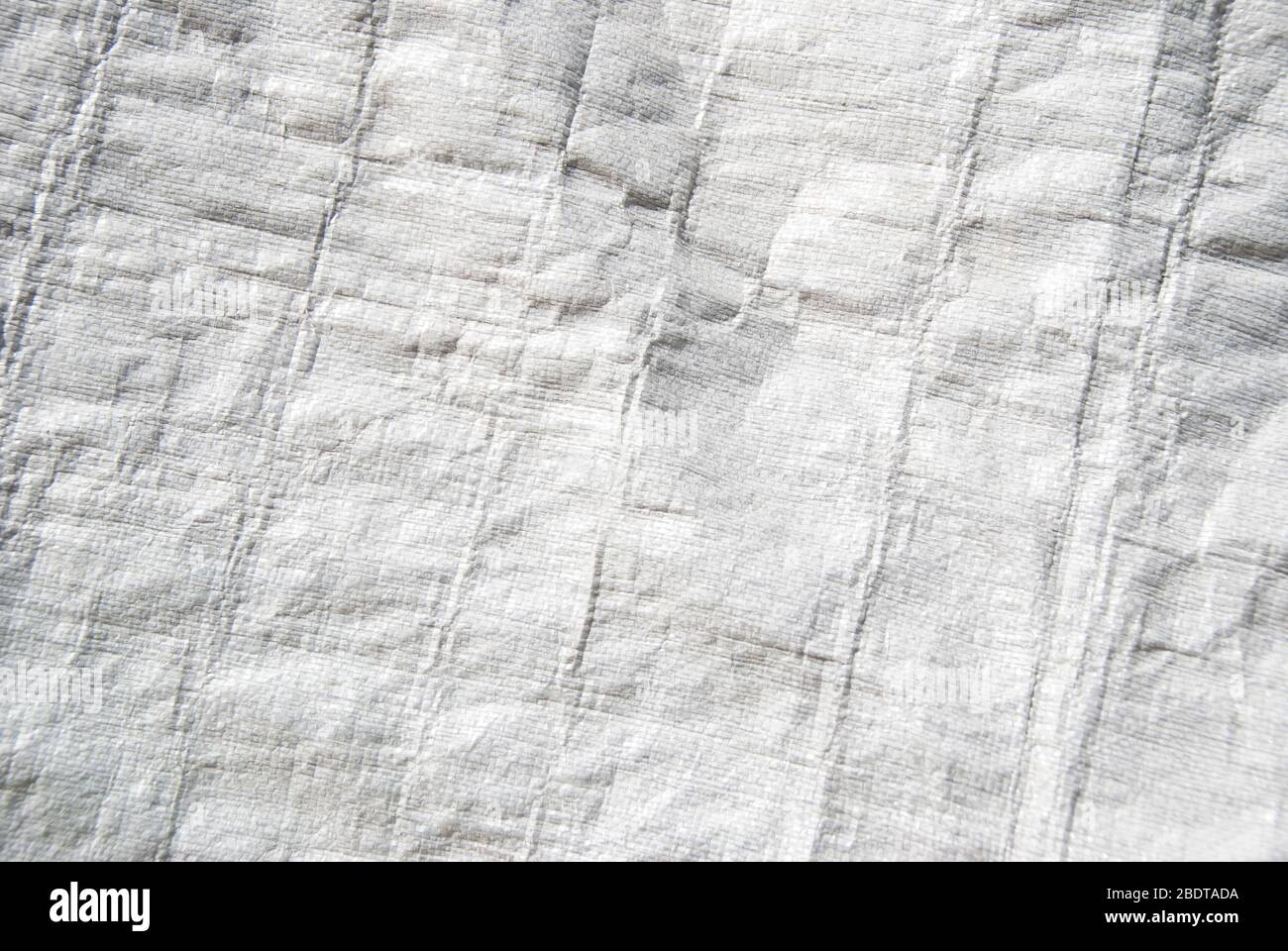 Full frame background of textured white industrial plastic sheeting