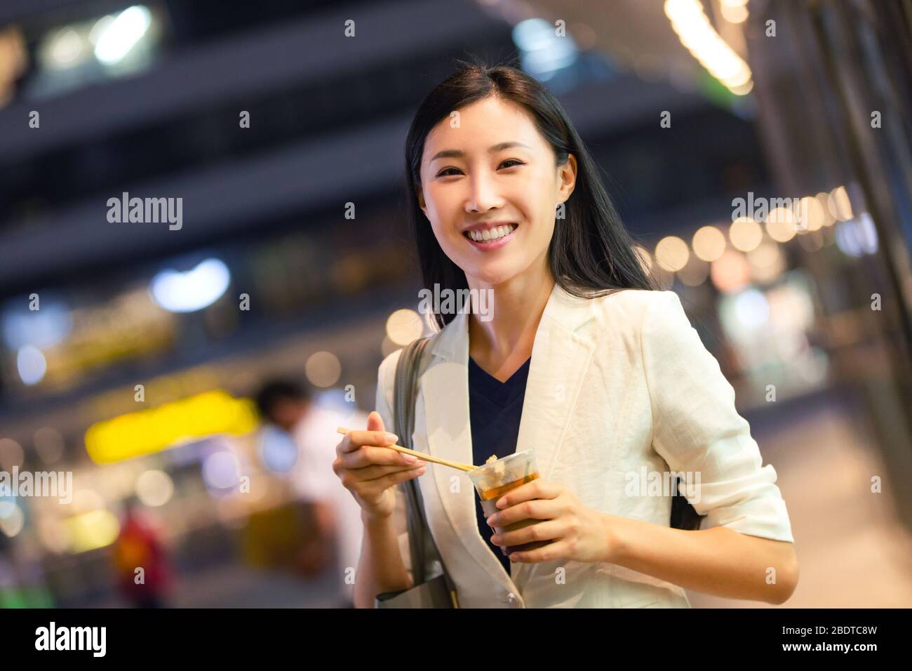 Business lady from work to eat on the road Stock Photo