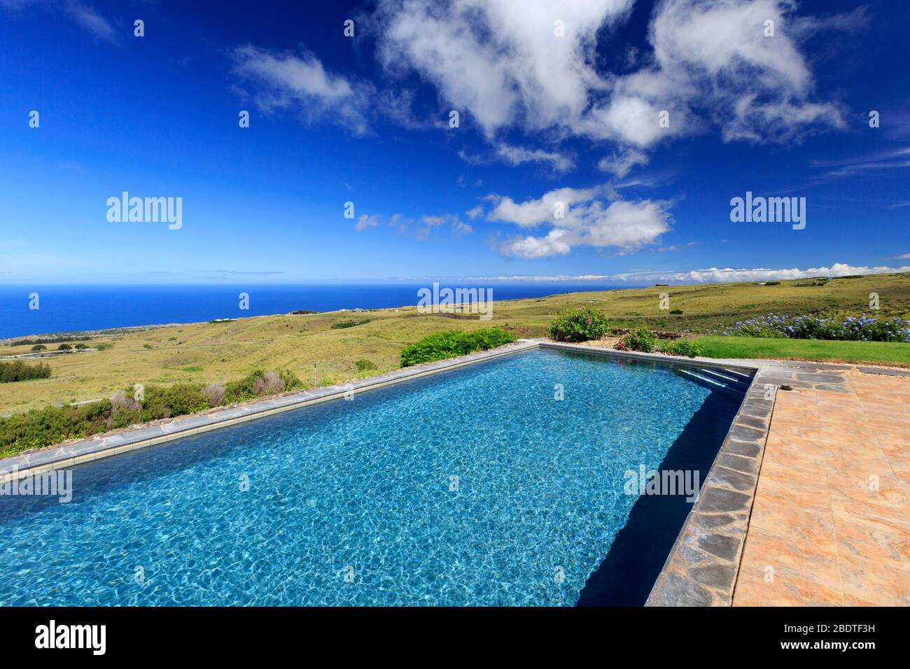 Pool (property released) with views of Pacific Ocean in North Kohala, Hawaii Stock Photo