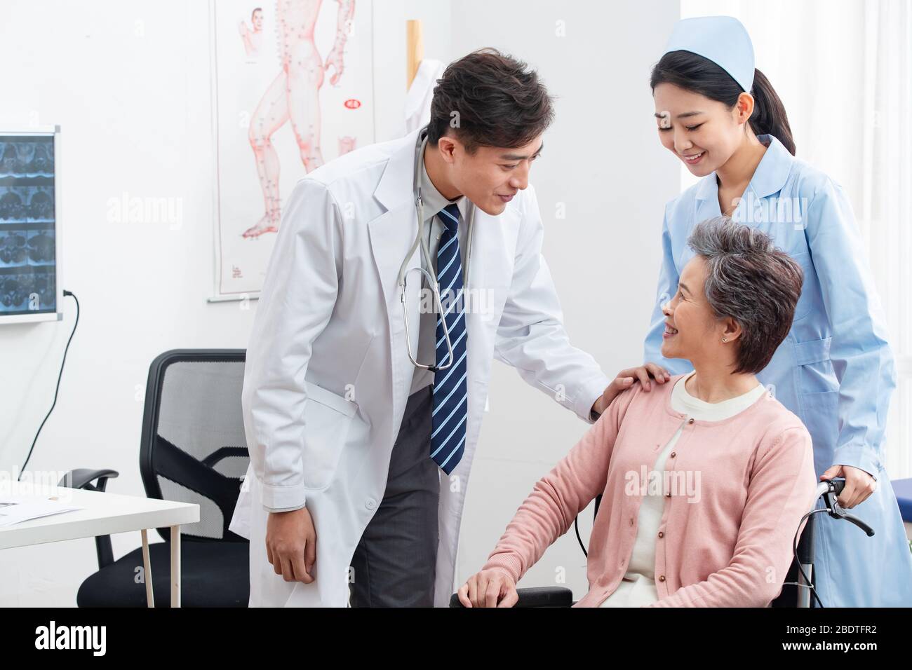 The doctor talked with elderly patients Stock Photo