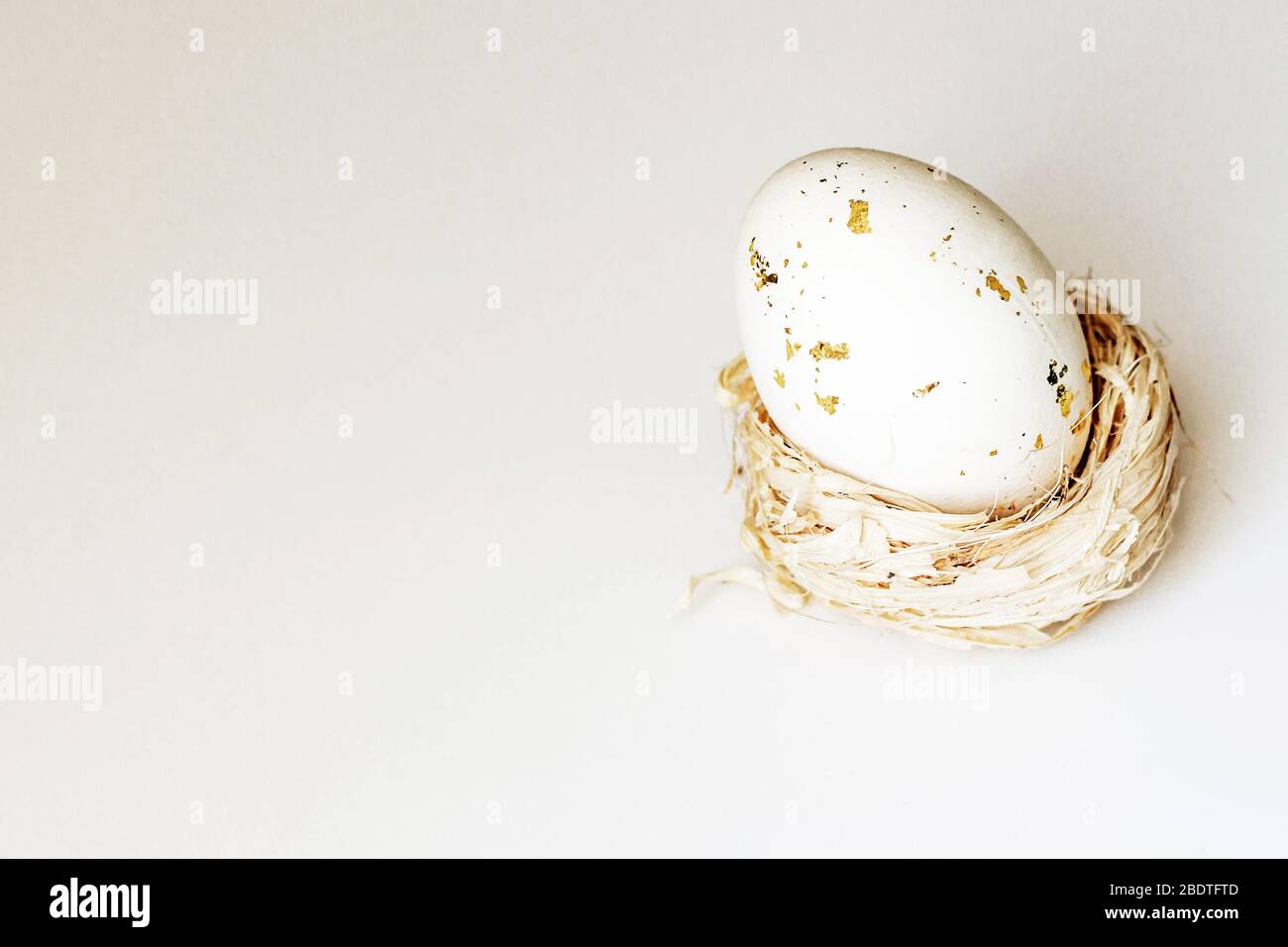 Egg In A Wicker Basket Or Nest On A White Background, Space For Text 