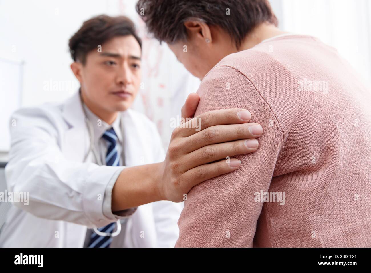 The doctor talked with elderly patients Stock Photo