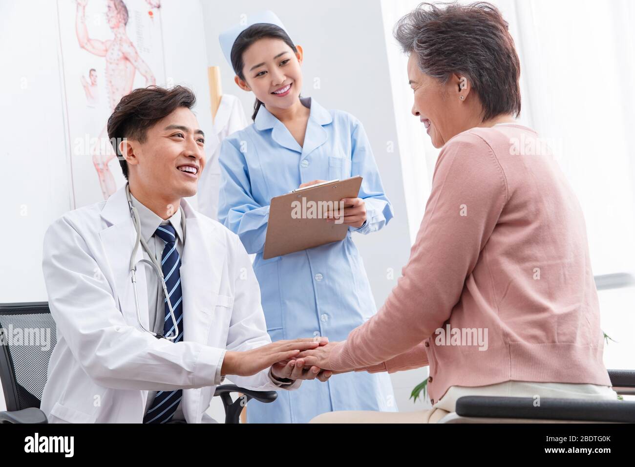 The doctor talked with elderly patients Stock Photo