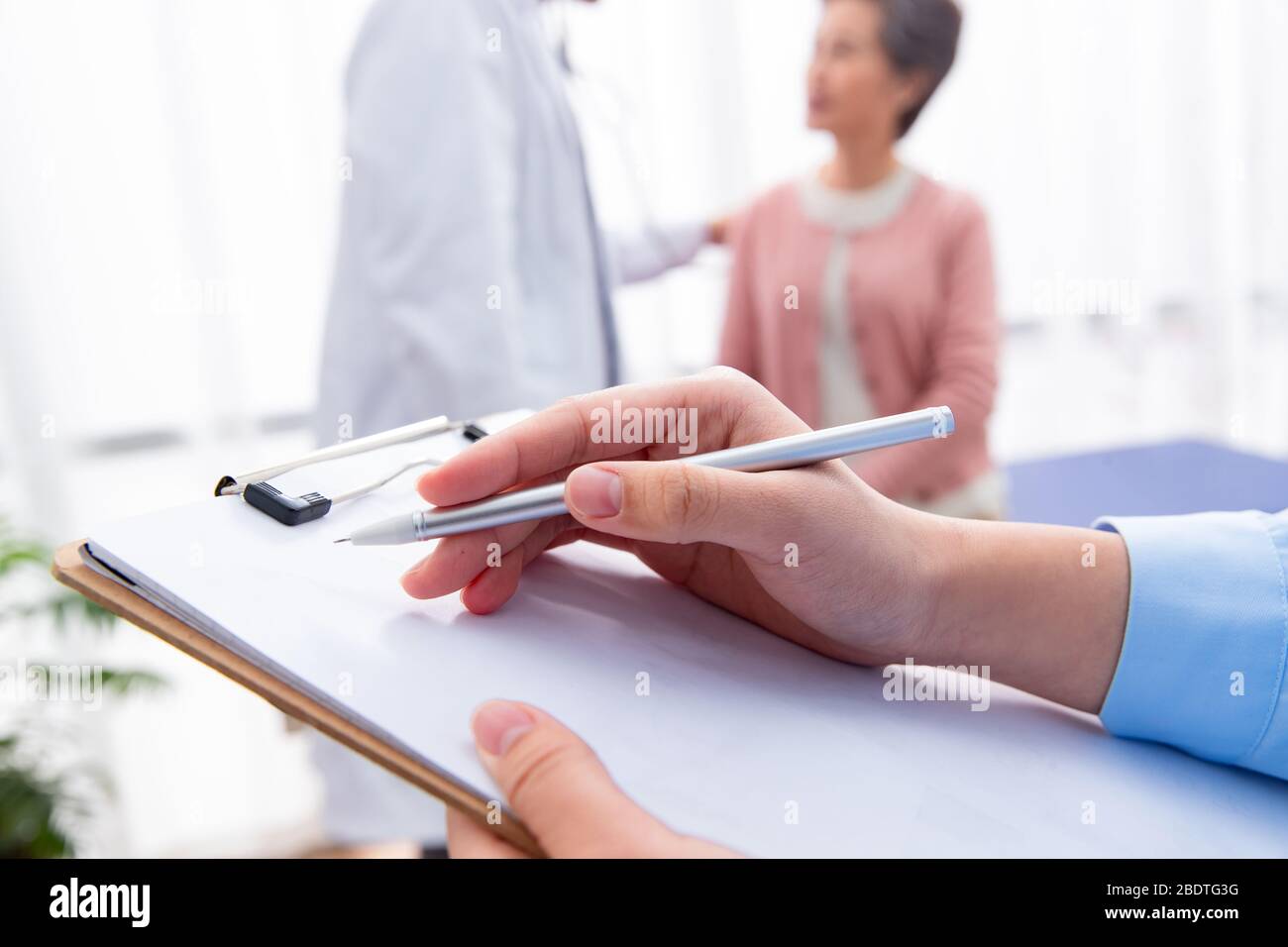 The doctor talked with elderly patients Stock Photo