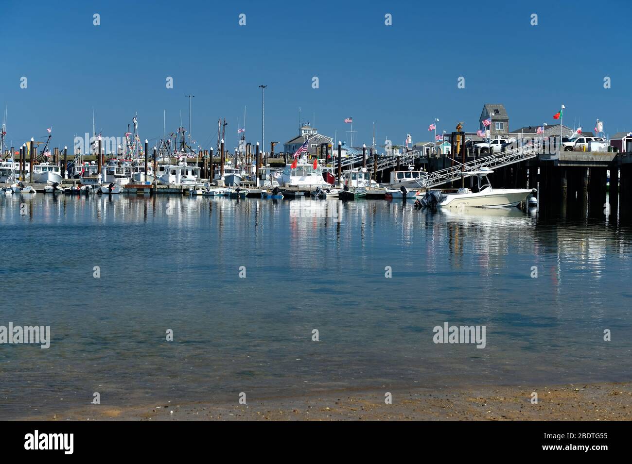 Macmillan Pier in Provincetown Harbor in the summer, on Cape Cod Stock Photo
