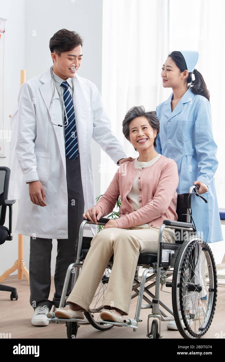 The doctor talked with elderly patients Stock Photo