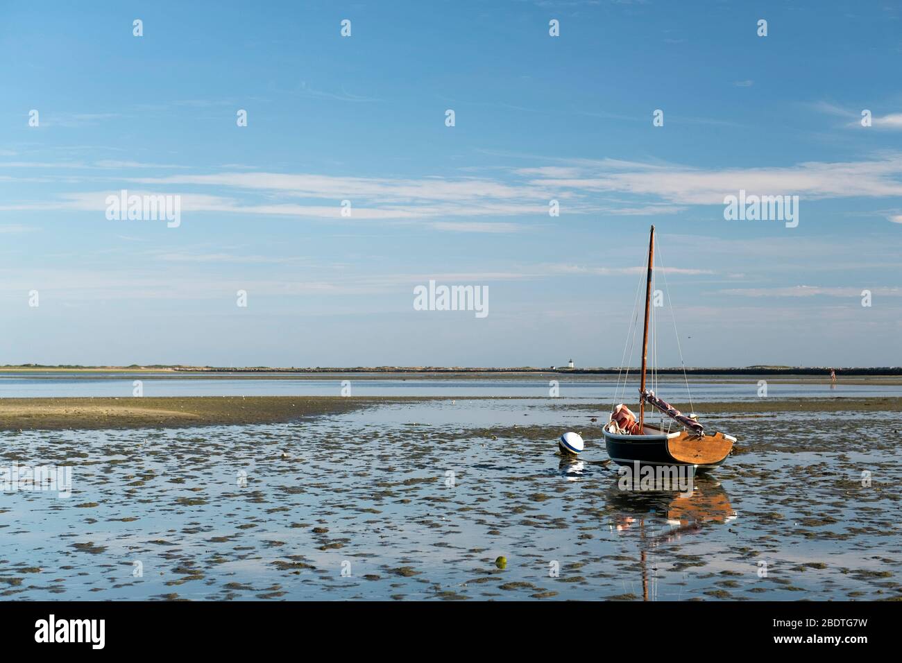 Dory at low tide in Provinetown Harbor on Cape Cod Stock Photo
