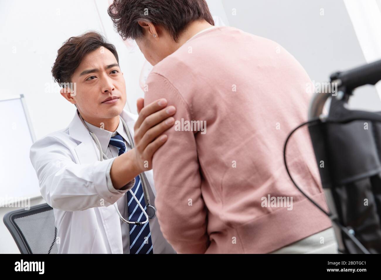 The doctor talked with elderly patients Stock Photo