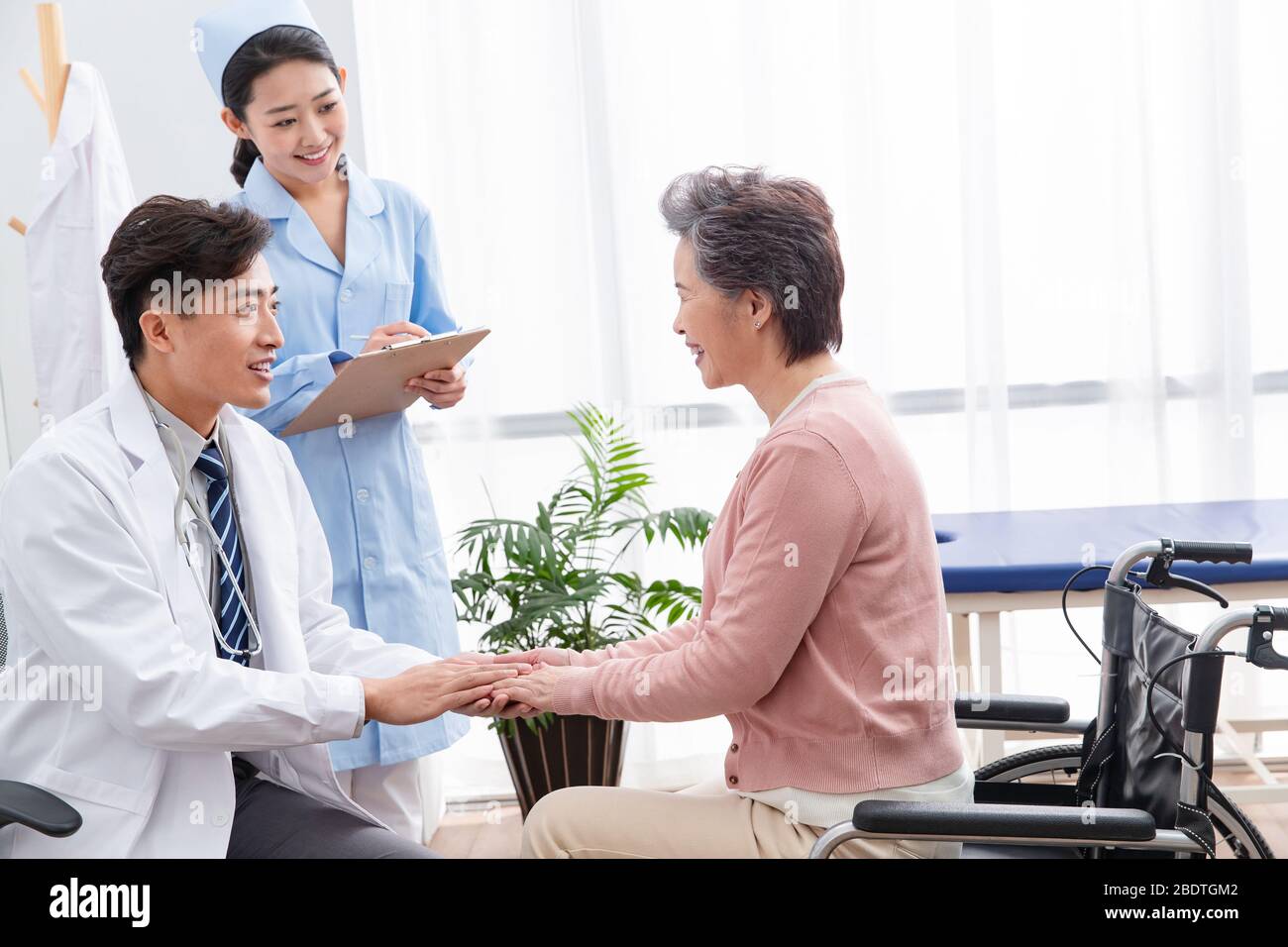 The doctor talked with elderly patients Stock Photo
