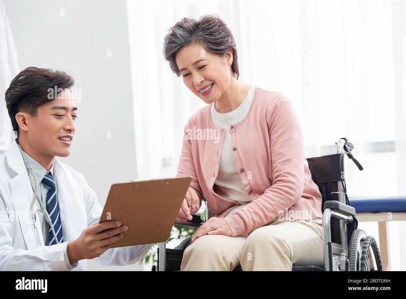 The doctor talked with elderly patients Stock Photo