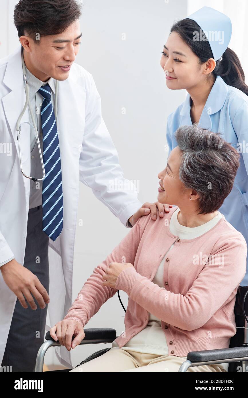 The doctor talked with elderly patients Stock Photo