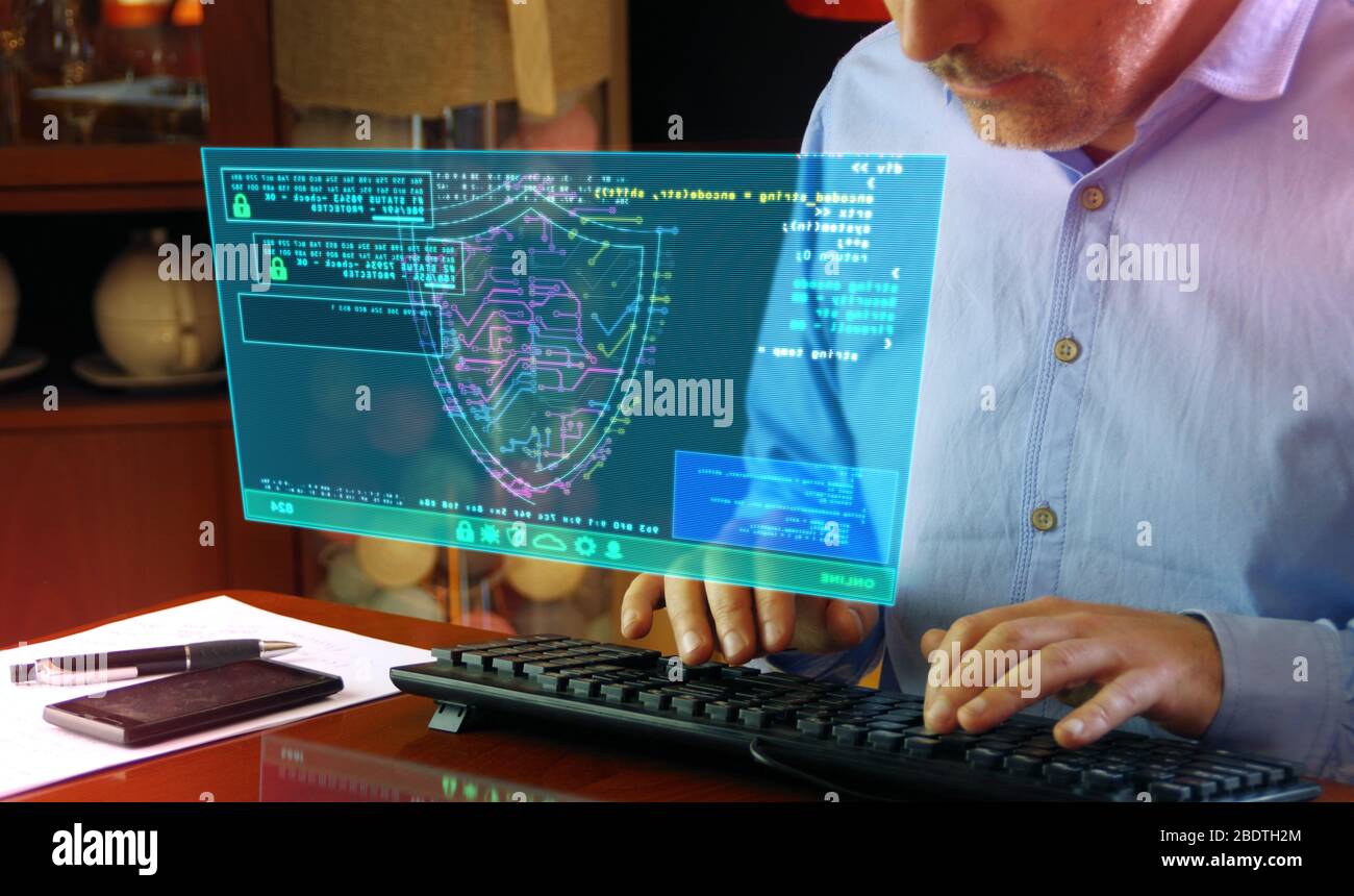 Man typing computer keyboard with futuristic hologram screen. Abstract concept of cyber security, computer protection, programming and internet safety Stock Photo