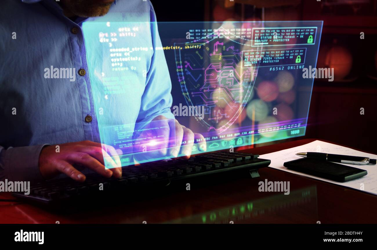 Man typing computer keyboard with futuristic hologram screen. Abstract concept of cyber security, computer protection, programming and internet safety Stock Photo
