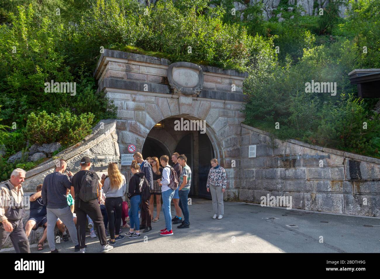 People standing beside the entrance tunnel leading to the lift/elevator up to the Eagle's Nest, Berchtesgaden, Bavaria, Germany. Stock Photo