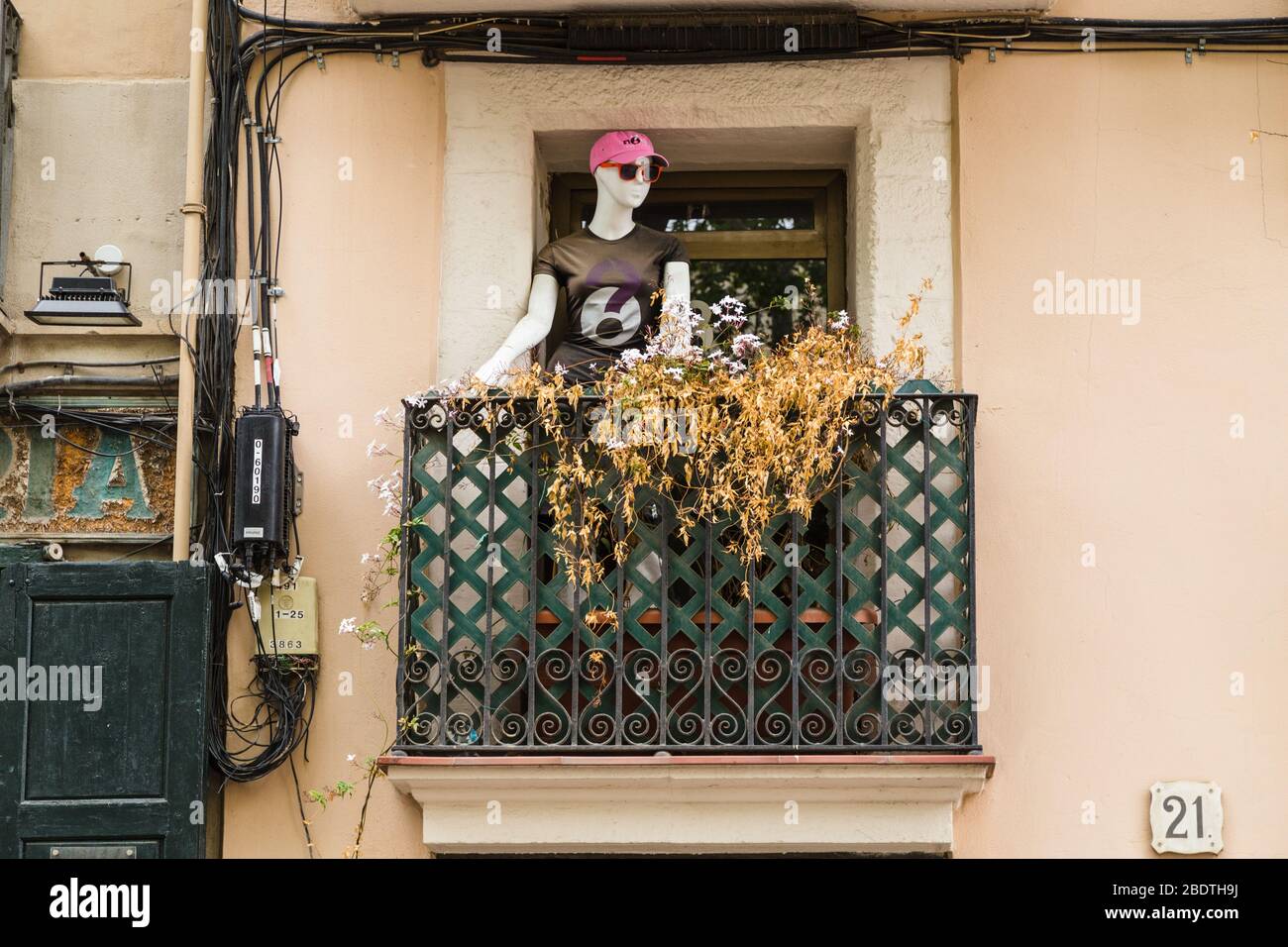 Barcelona balcony decorated with tailor's dummy. Stock Photo