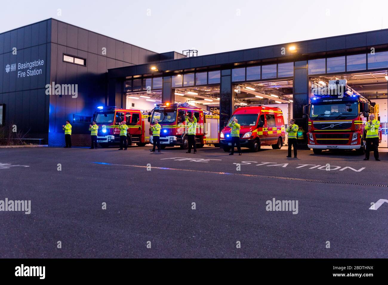 fire service paying tribute to NHS by clapping 8pm in Hampshire Basingstoke firemen clapping Stock Photo