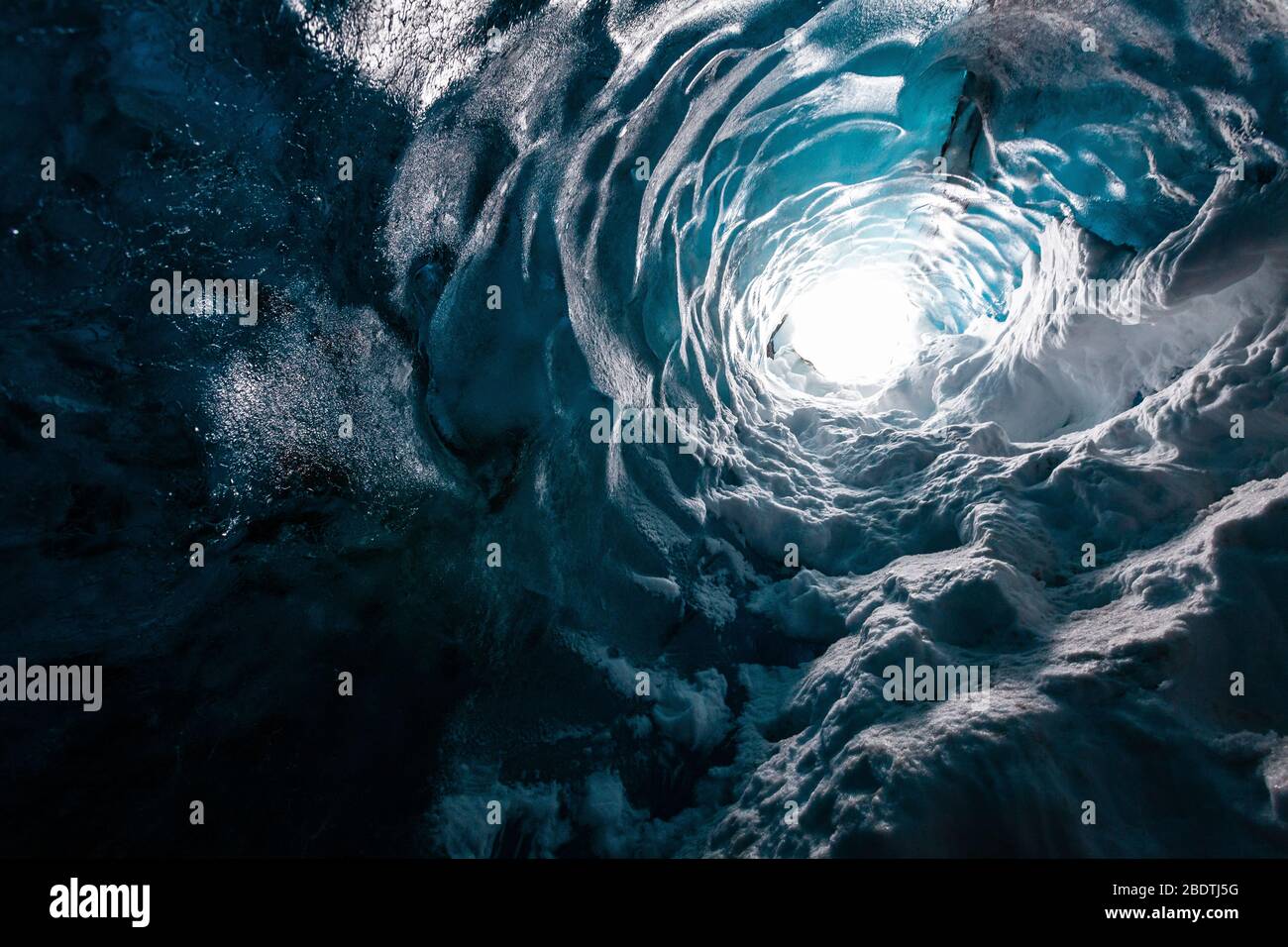 Shaft or natural skylight into a glacier ice cave, Iceland Stock Photo