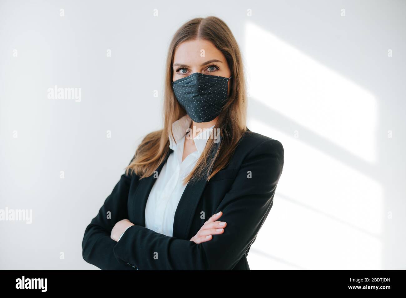 photo of successful business woman wearing a breathing mask Stock Photo