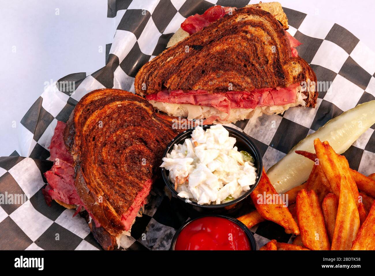 Reuben sandwich with fries and cole slaw, by James D Coppinger/Dembinsky Photo Assoc Stock Photo