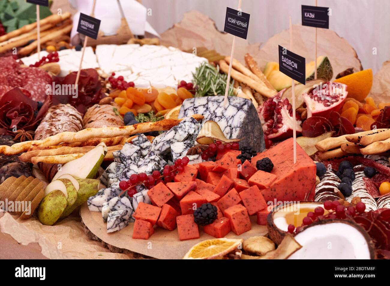 A close up of many different types of apitizers. Italian antipasti wine